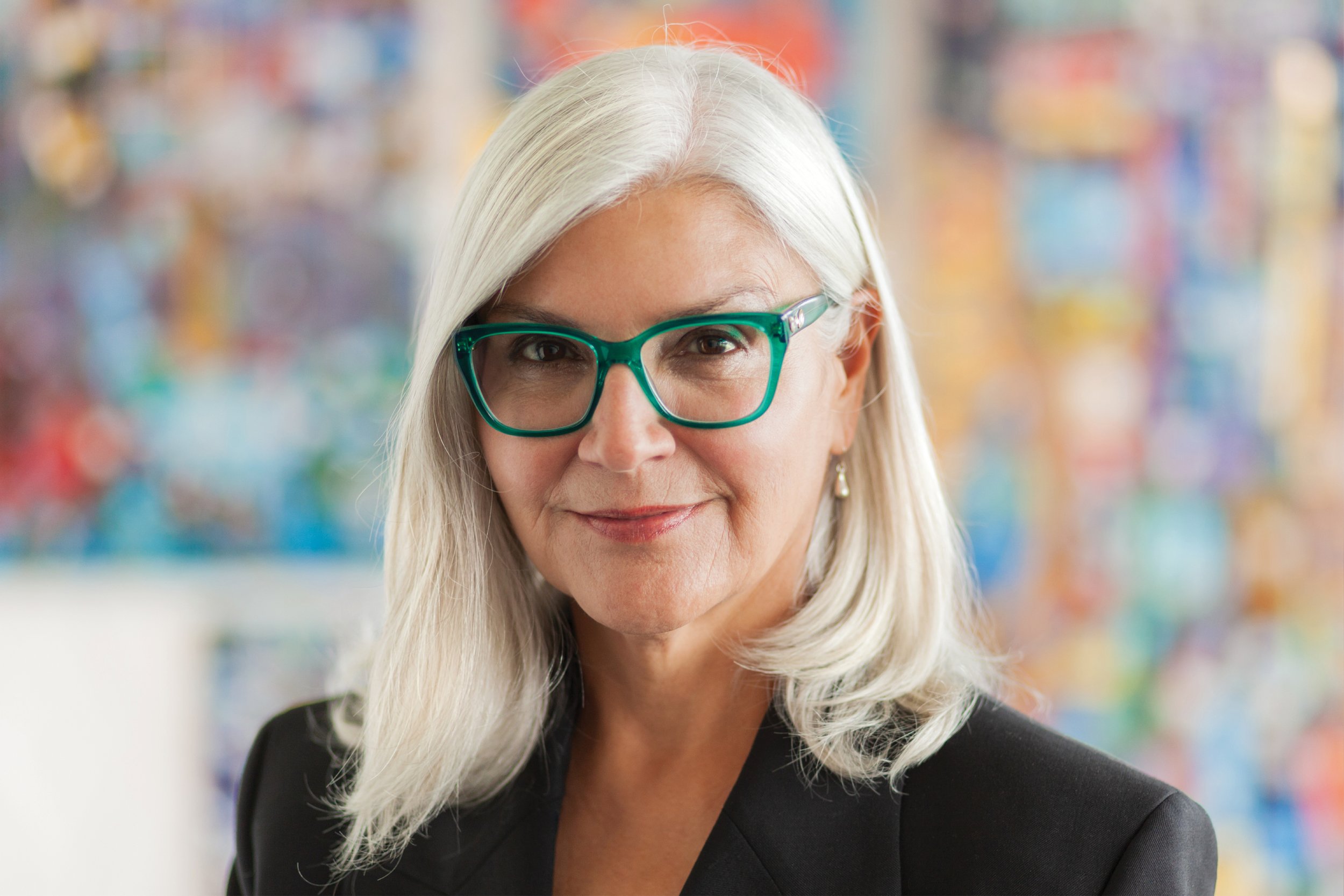 Danette Riddle, Vice President and Marketing and Communications leader, headshot taken in a LEO A DALY office.