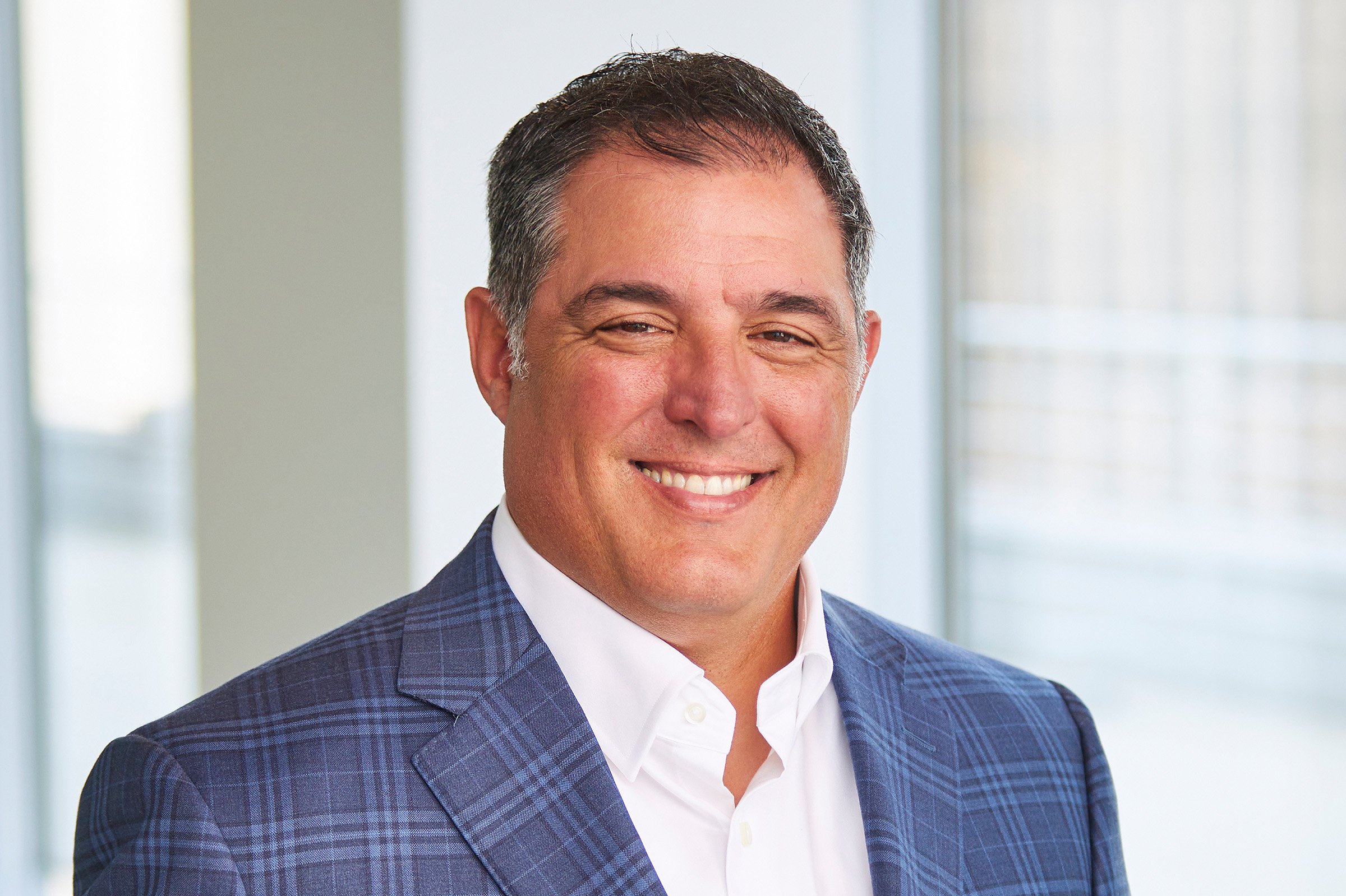 John Somerville, Executive Vice President headshot taken in a LEO A DALY office.
